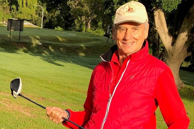 Professor Tim Roberts playing golf — active ageing through exercise, hydration and nutritional recovery support
