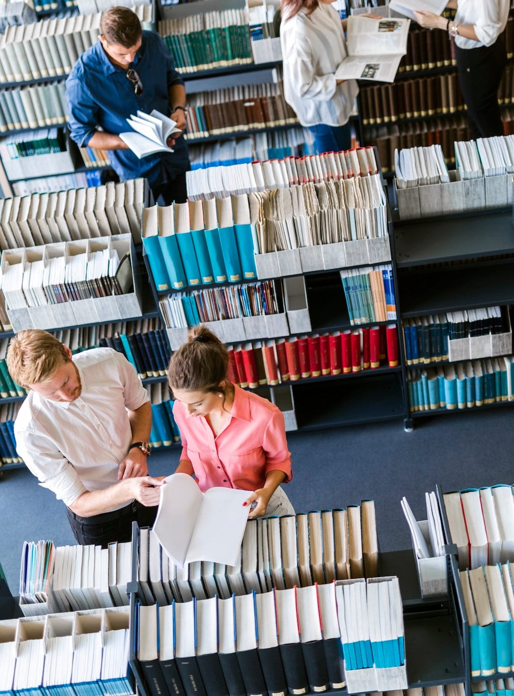 People browsing books in a library from an aerial view